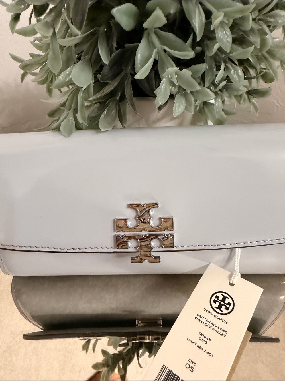 Tory Burch Britten Envelope Wallet in "Light Sea" patent leather